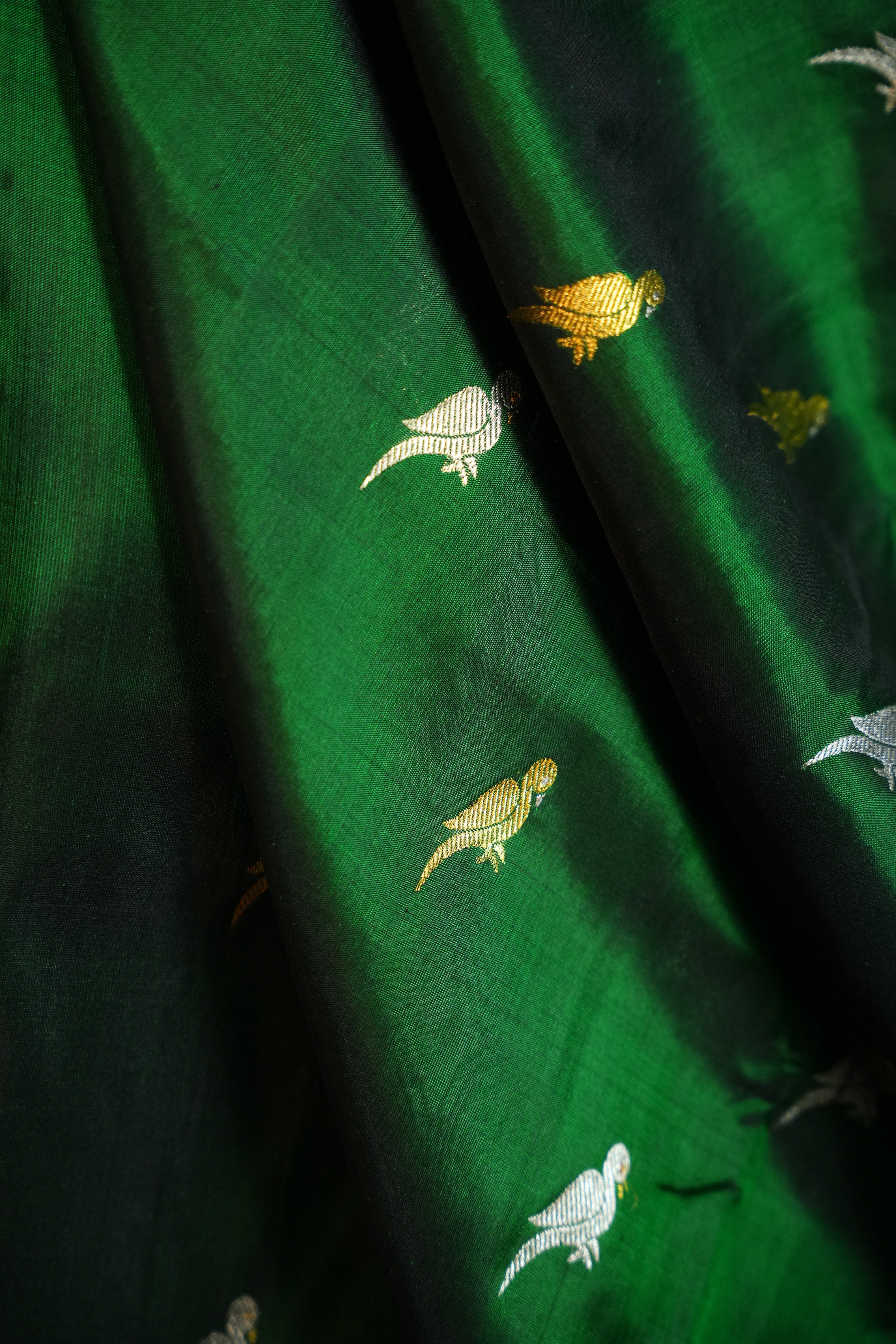 Emerald Green Maharani Pattu Silk Saree with Blue Peacock Border