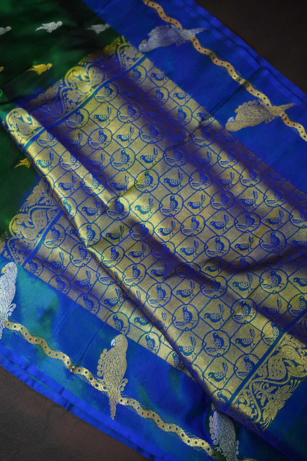 Emerald Green Maharani Pattu Silk Saree with Blue Peacock Border