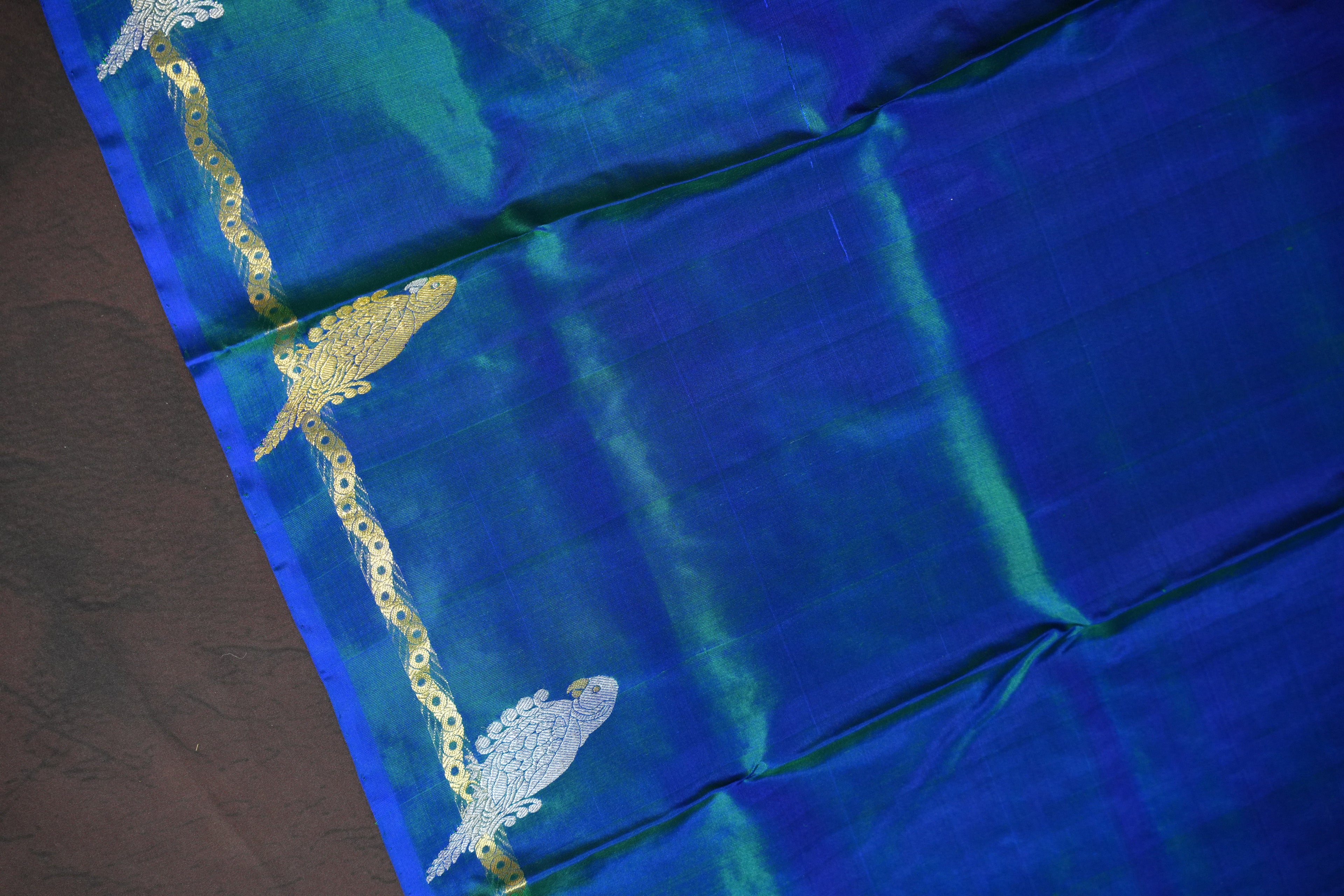 Emerald Green Maharani Pattu Silk Saree with Blue Peacock Border