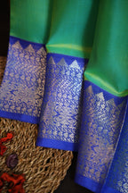 Pastel Green Maharani Pattu Silk Saree with Royal Blue Zari Border