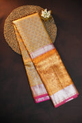 Kanchi Pattu Saree in Golden Beige with Pink Border