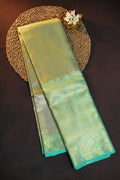 Kanchi Pattu Saree in Olive Gold with Aqua Blue Border