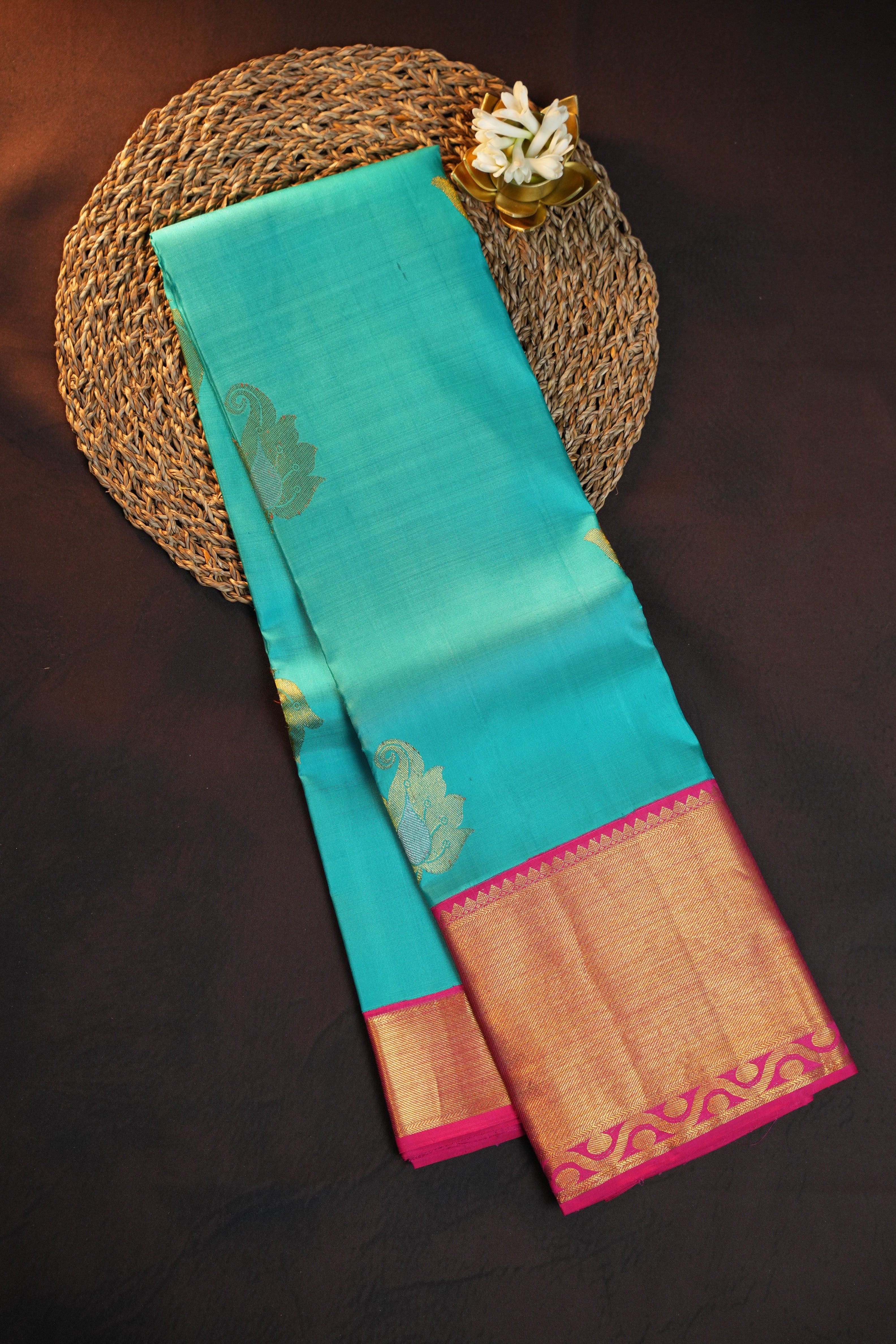 Turquoise Kanchi Pattu Saree with Pink Zari Border