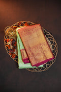 Mint Green Kanchi Pattu Saree with Pink Gold Zari Border