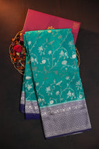 Turquoise Fancy Banaras Saree with Silver Bird & Floral Weaving