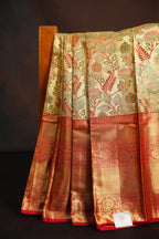 Golden Floral Kanchi Pattu Saree with Rich Red Zari Border