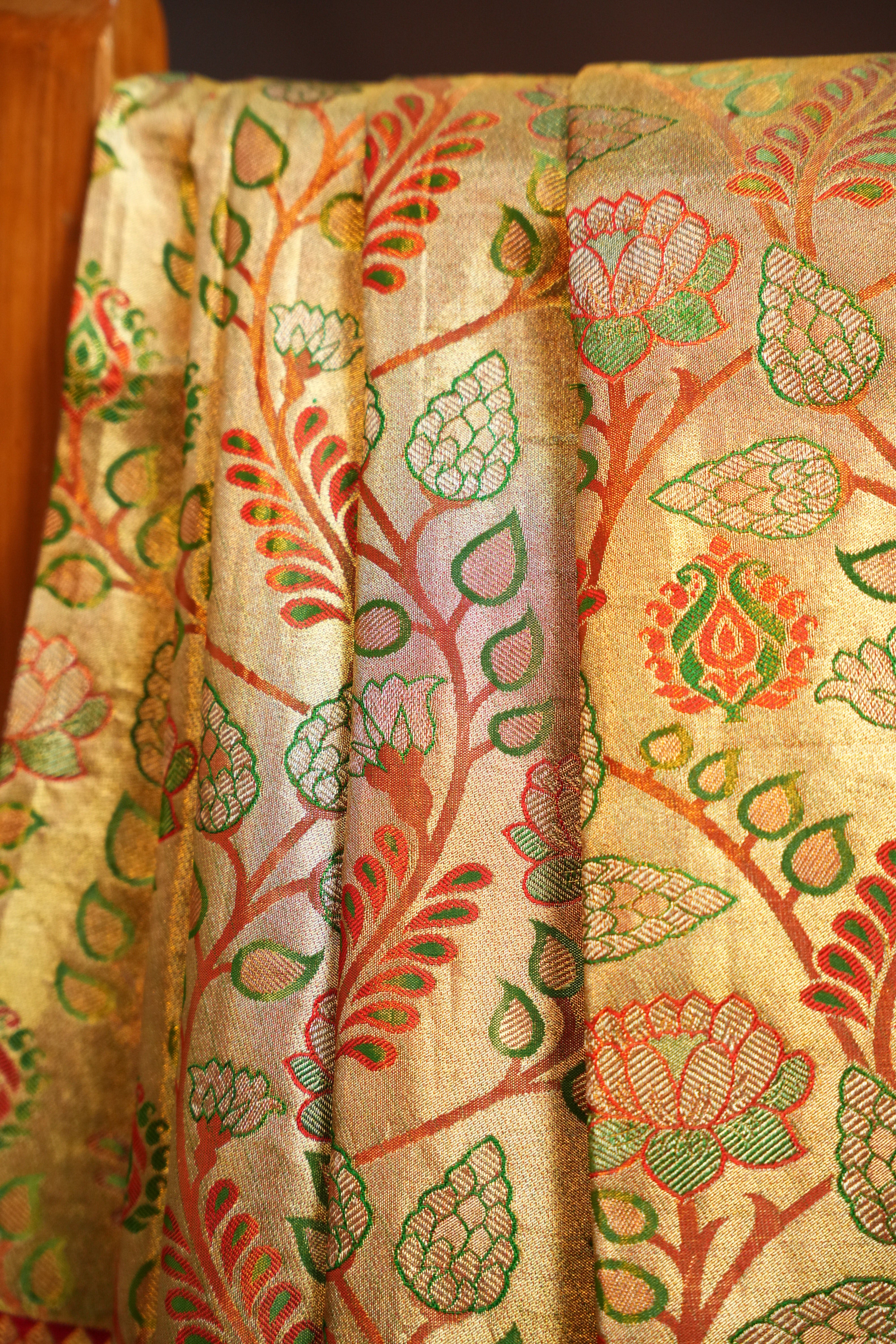 Golden Floral Kanchi Pattu Saree with Rich Red Zari Border