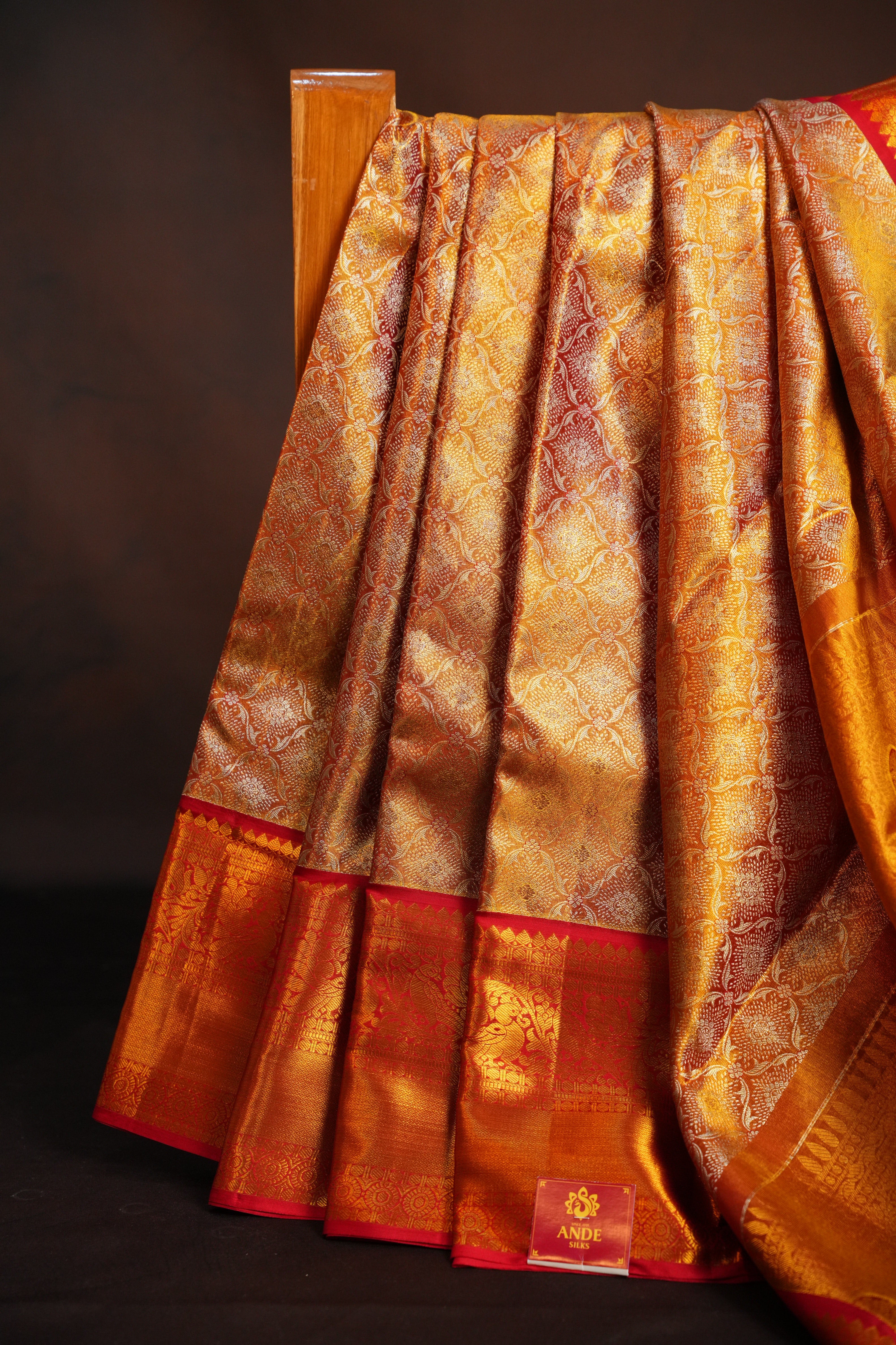 Kanchi Pattu Saree in Copper Gold with Red Border