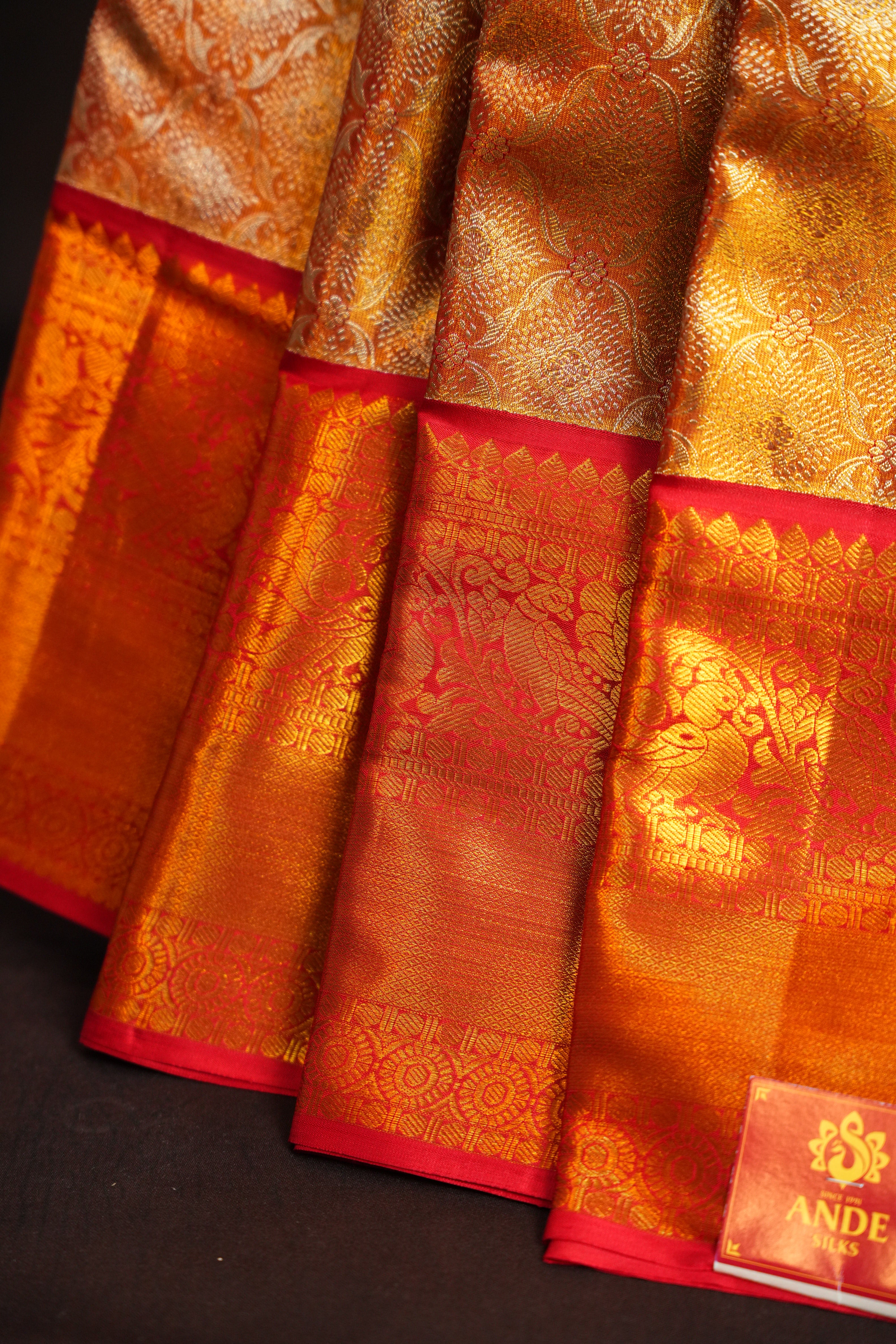 Kanchi Pattu Saree in Copper Gold with Red Border