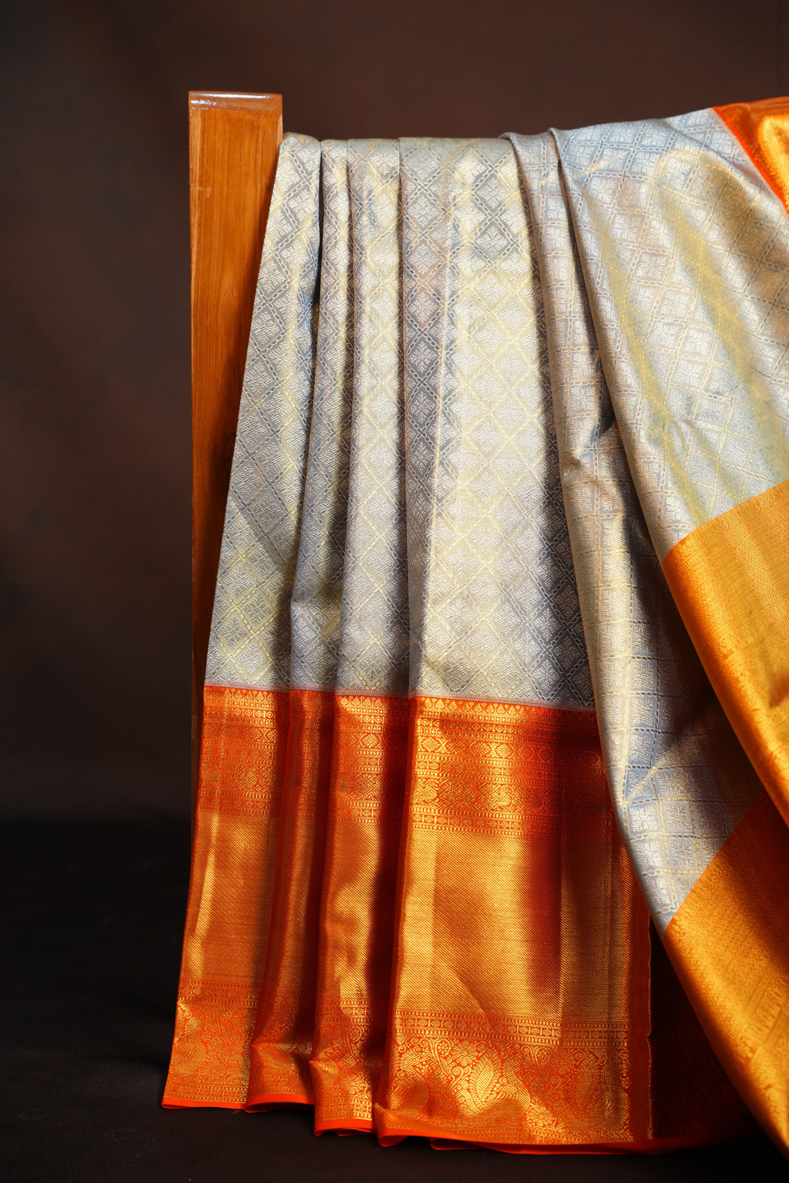 Kanchi Pattu Saree in Silver Grey with Orange Border