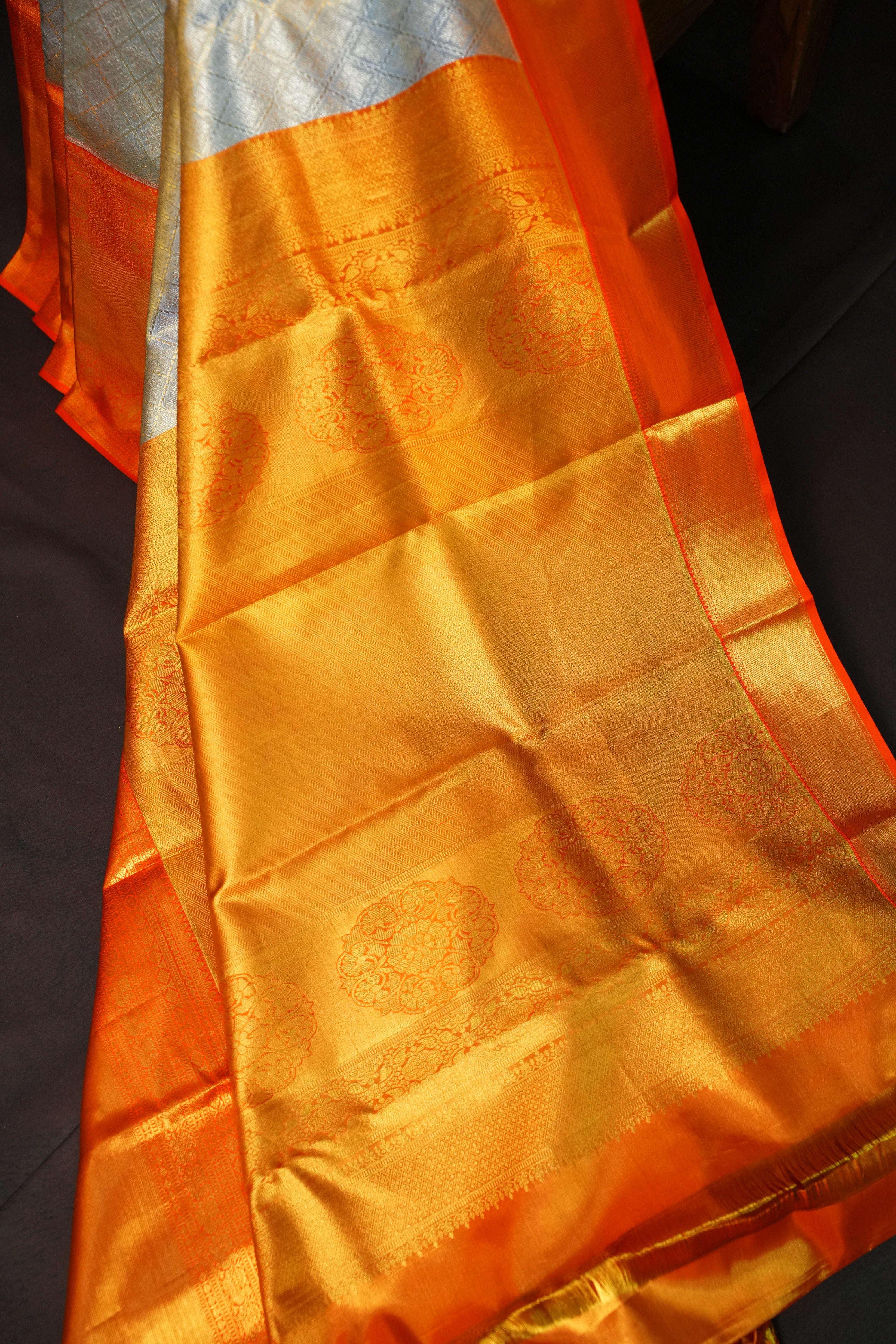 Kanchi Pattu Saree in Silver Grey with Orange Border