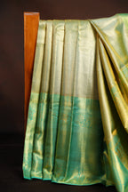 Kanchi Pattu Saree in Olive Gold with Aqua Blue Border