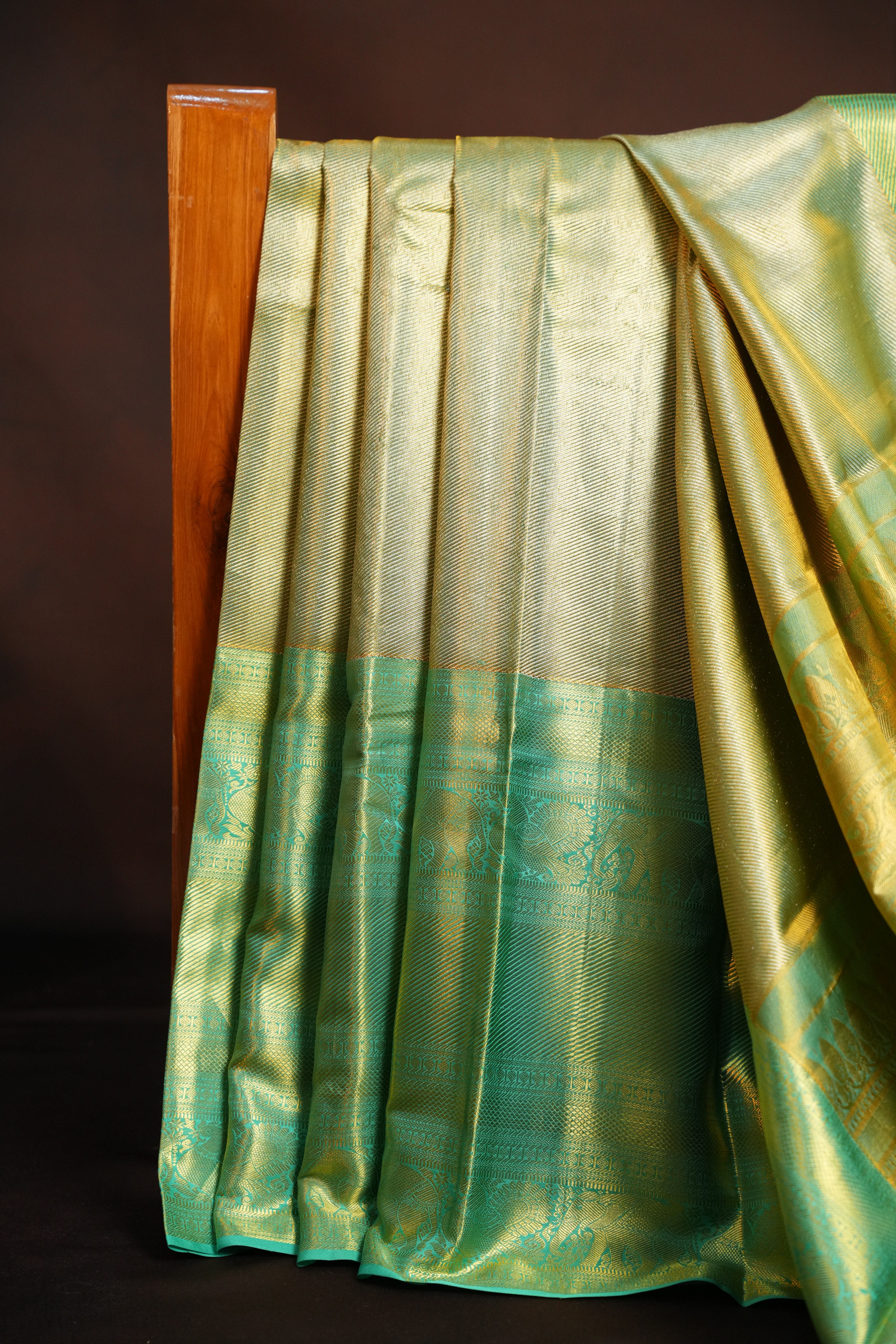 Kanchi Pattu Saree in Olive Gold with Aqua Blue Border