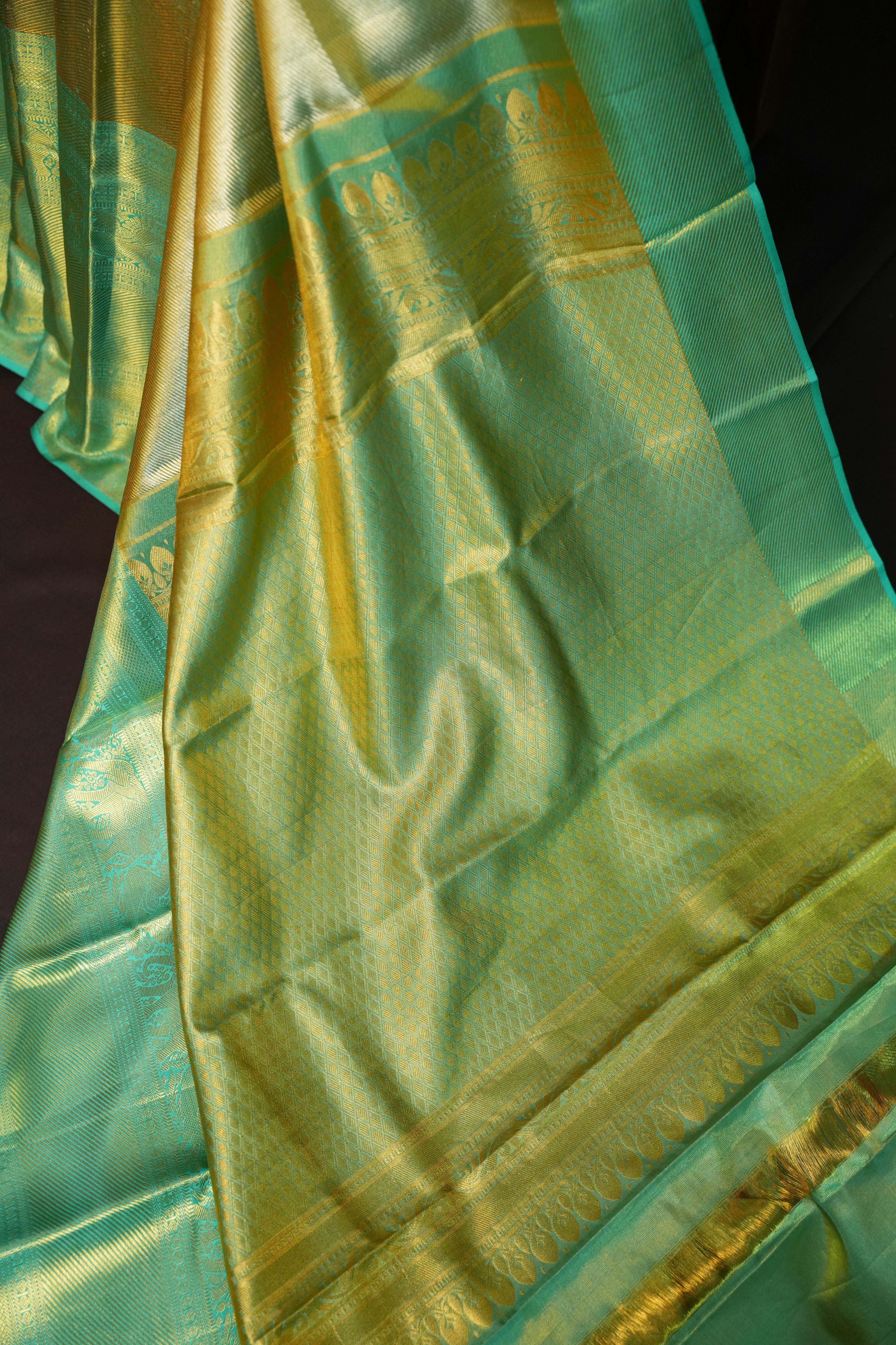 Kanchi Pattu Saree in Olive Gold with Aqua Blue Border
