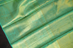 Kanchi Pattu Saree in Olive Gold with Aqua Blue Border