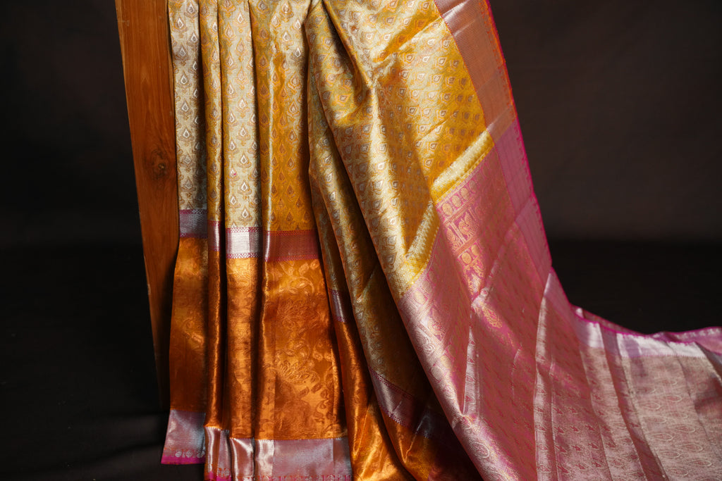 Kanchi Pattu Saree in Golden Beige with Pink Border