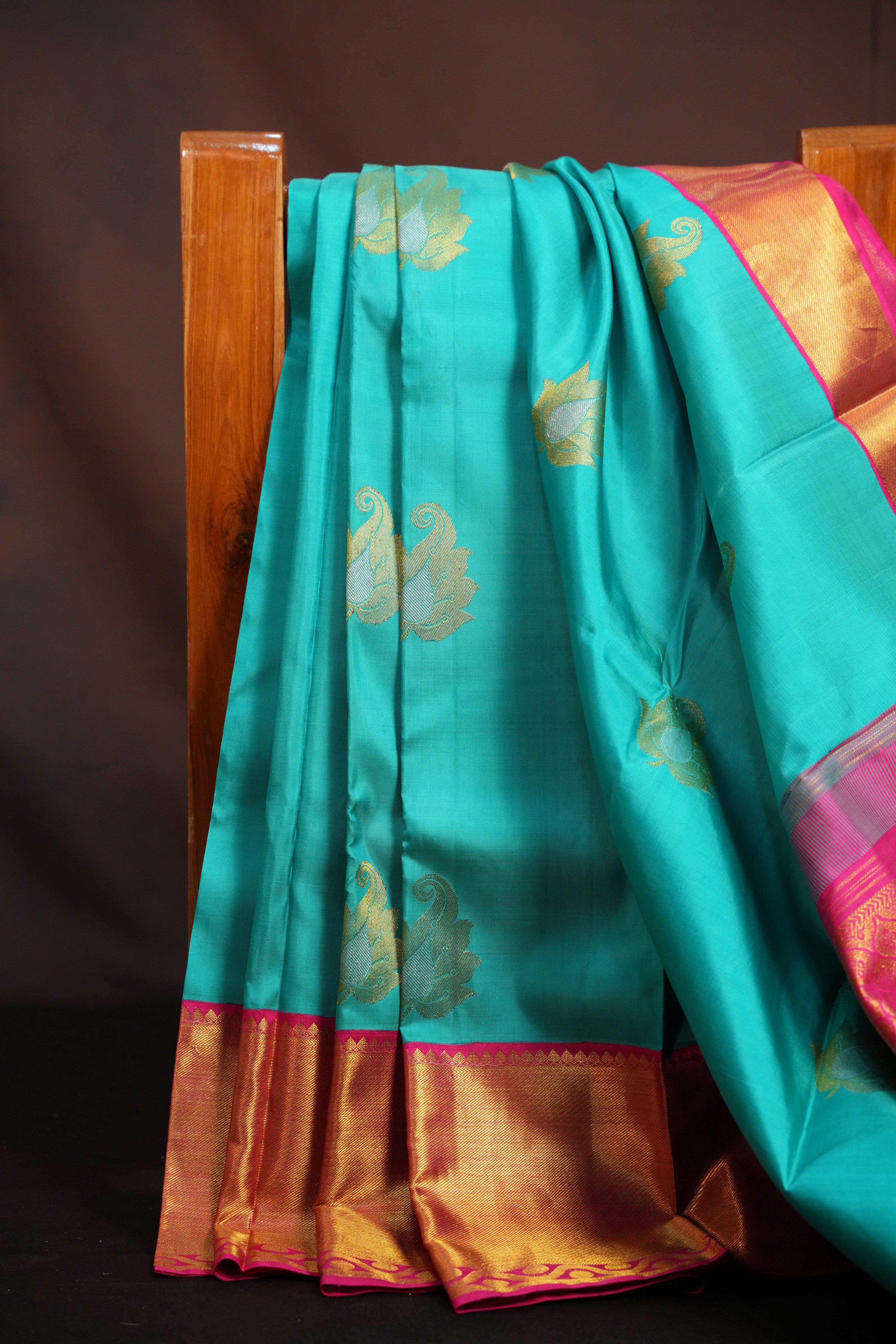 Turquoise Kanchi Pattu Saree with Pink Zari Border