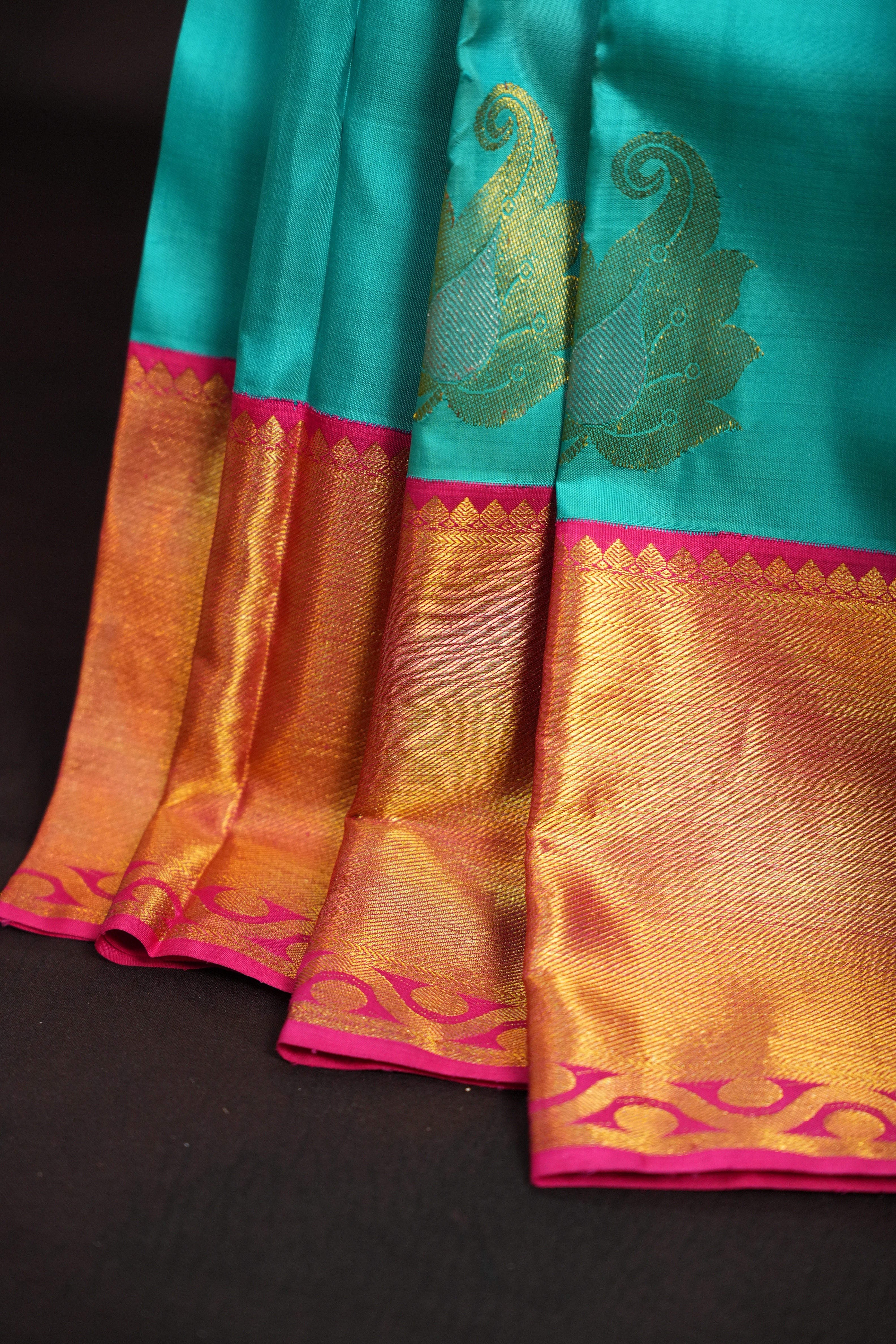 Turquoise Kanchi Pattu Saree with Pink Zari Border