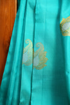 Turquoise Kanchi Pattu Saree with Pink Zari Border