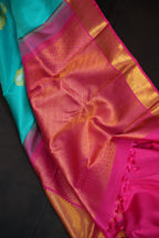 Turquoise Kanchi Pattu Saree with Pink Zari Border