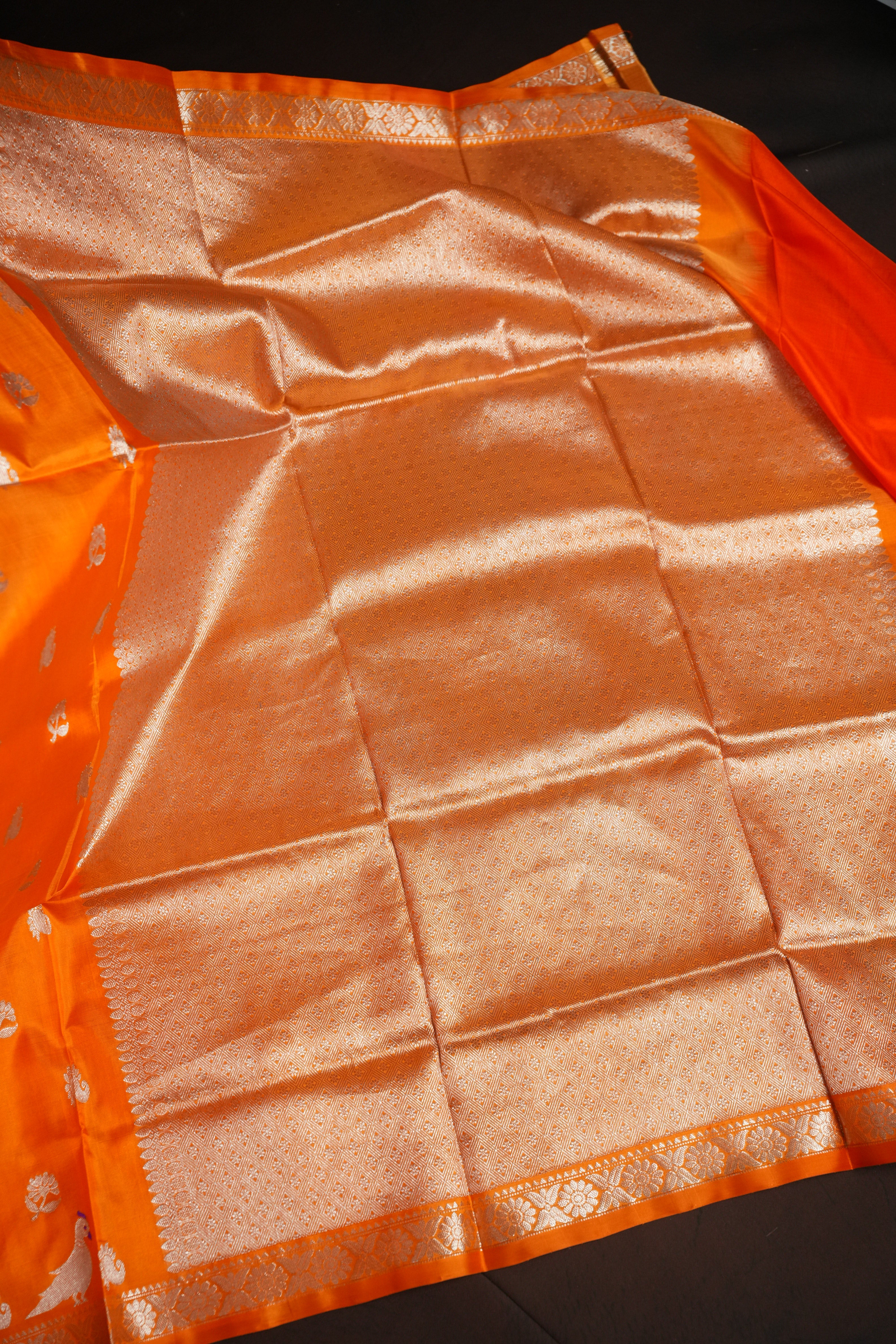 Orange Maharani Pattu Saree with Silver Peacock Motifs