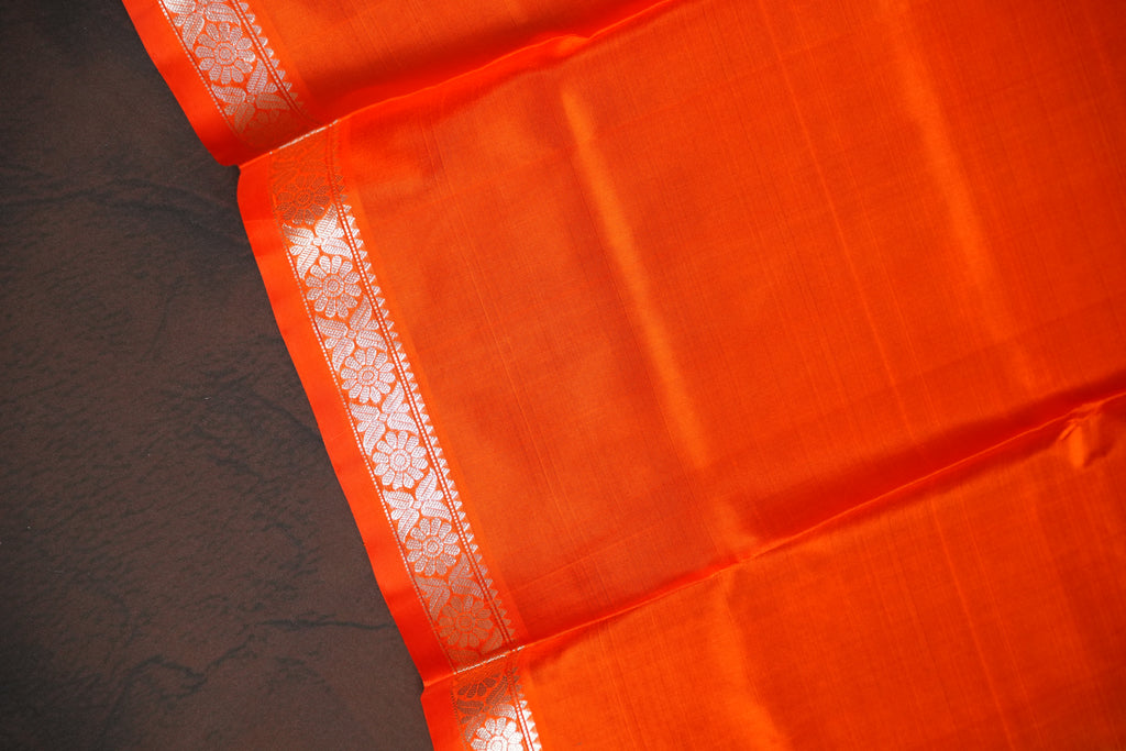 Orange Maharani Pattu Saree with Silver Peacock Motifs