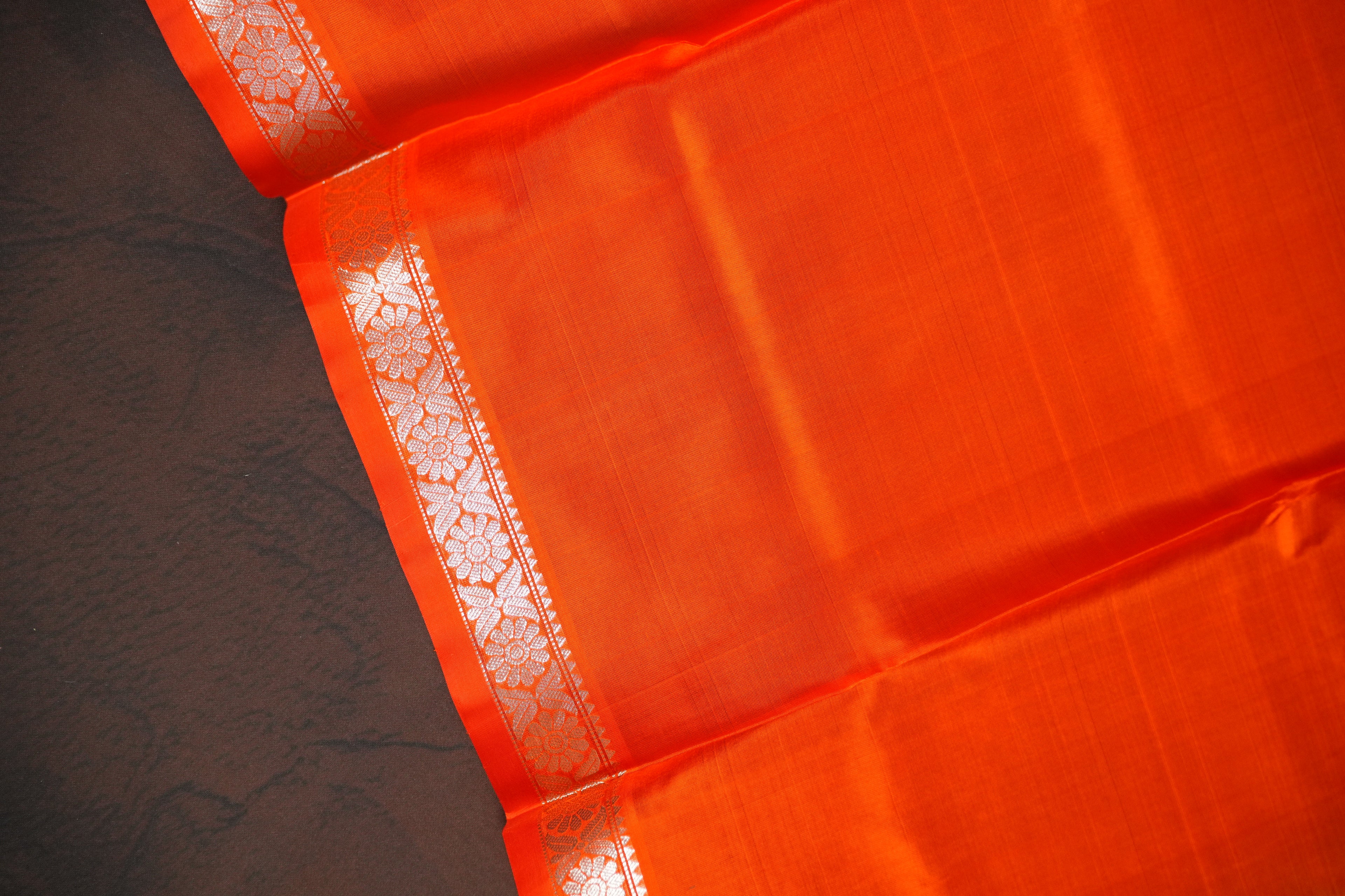 Orange Maharani Pattu Saree with Silver Peacock Motifs